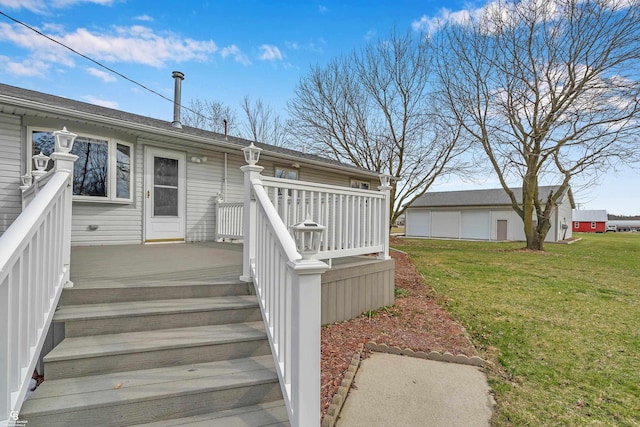 property entrance with a lawn and a wooden deck