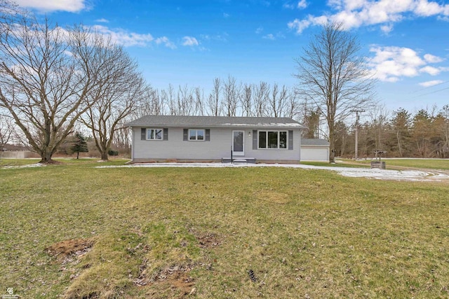 ranch-style home with a garage and a front lawn