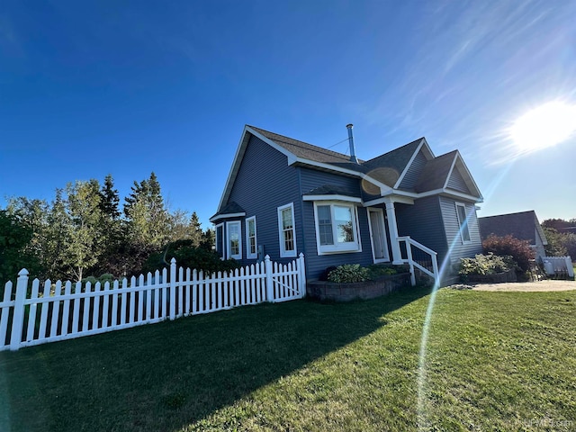 view of home's exterior featuring a lawn