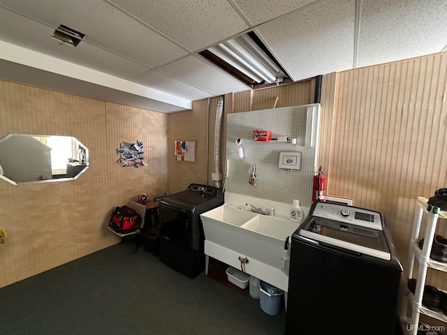 washroom featuring sink and washing machine and clothes dryer