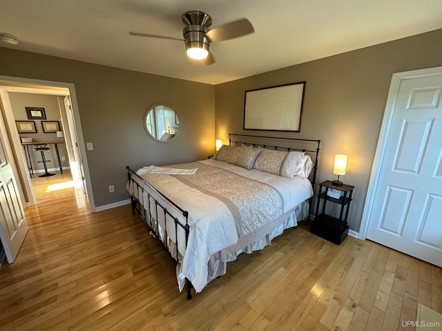 bedroom featuring light wood-type flooring and ceiling fan