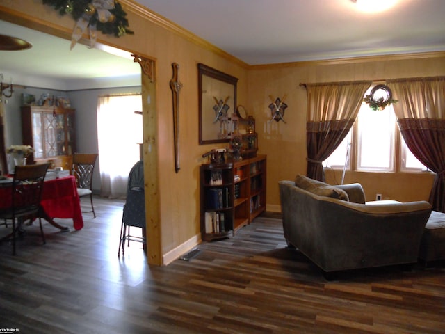 living room with ornamental molding and dark wood-type flooring