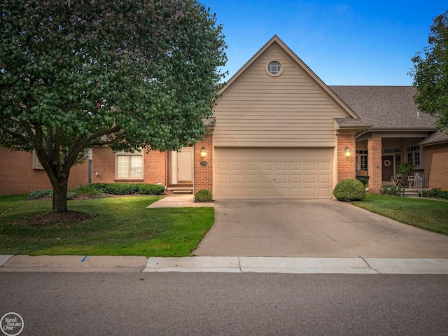 view of front facade with a garage and a front yard