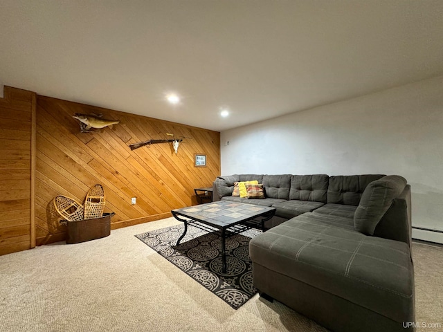 living room with wooden walls and carpet flooring