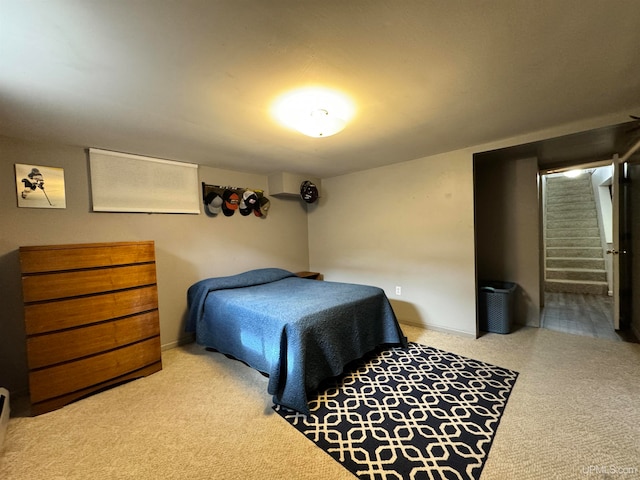 carpeted bedroom featuring connected bathroom