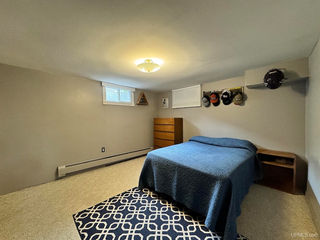 carpeted bedroom featuring a baseboard heating unit