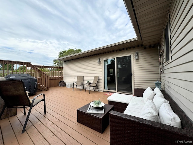 wooden terrace featuring grilling area and outdoor lounge area