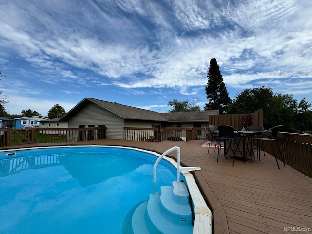 view of pool with a deck