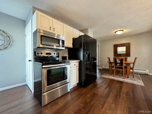 kitchen featuring white cabinets, a textured ceiling, appliances with stainless steel finishes, and dark wood-type flooring