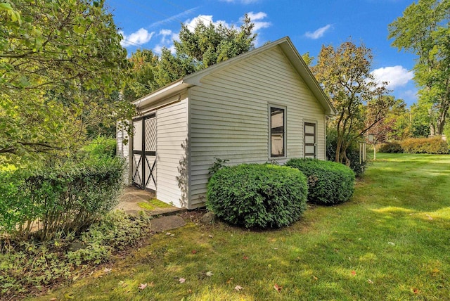 view of home's exterior featuring a yard