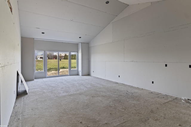 empty room featuring high vaulted ceiling