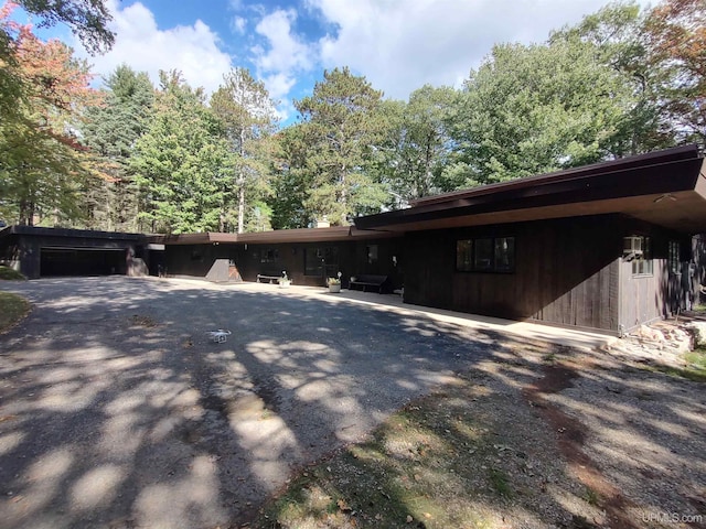 view of side of home with a garage