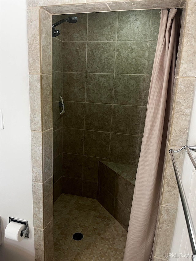 bathroom with a shower with shower curtain