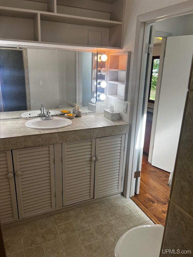 bathroom featuring vanity and hardwood / wood-style floors