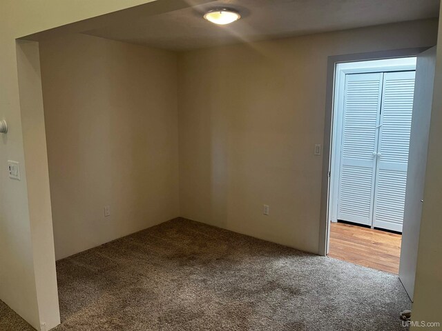 unfurnished room featuring carpet flooring