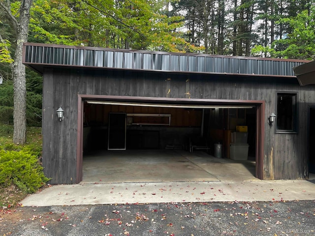 garage featuring wood walls