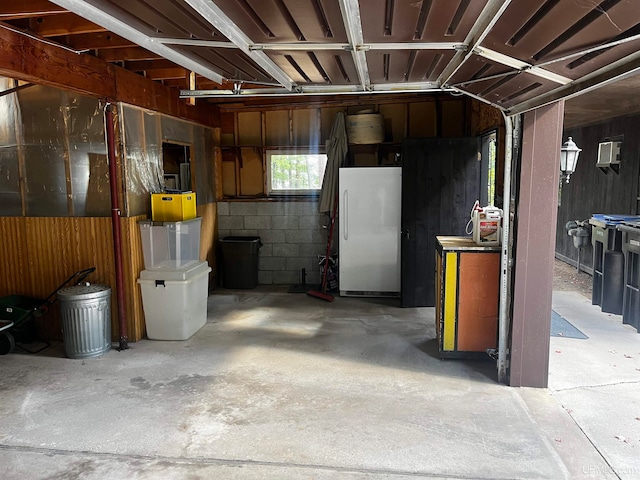 garage featuring white fridge