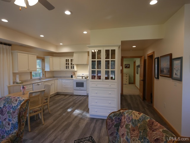 kitchen featuring dark hardwood / wood-style floors, sink, white cabinets, white appliances, and ceiling fan