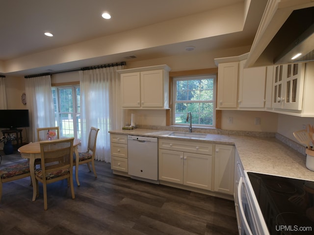 kitchen with white appliances, white cabinetry, and sink