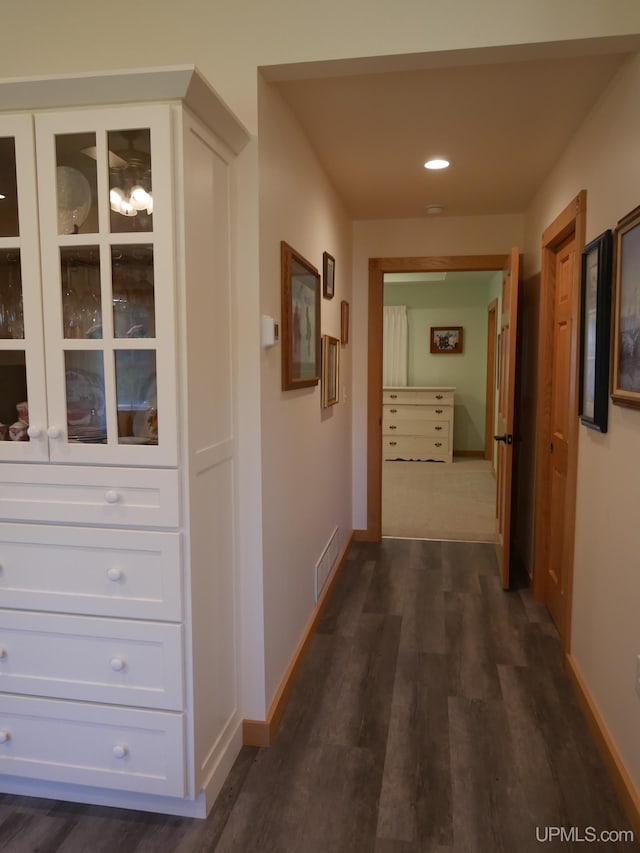 hallway featuring dark hardwood / wood-style floors