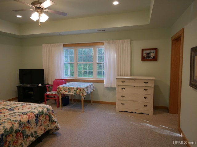 bedroom featuring light carpet and ceiling fan