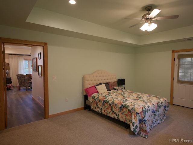 bedroom featuring ceiling fan and carpet