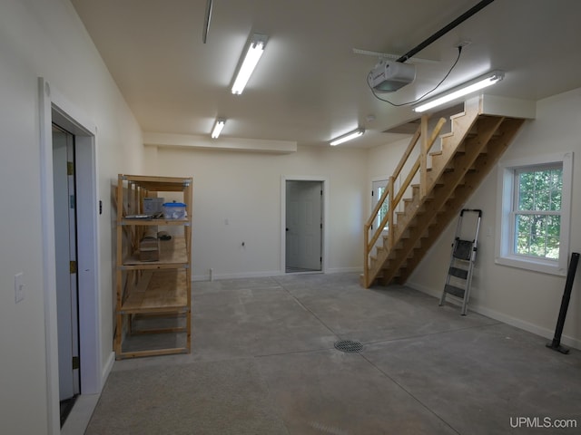 interior space featuring baseboards and stairs