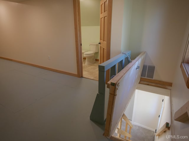 interior space with visible vents, baseboards, and finished concrete flooring