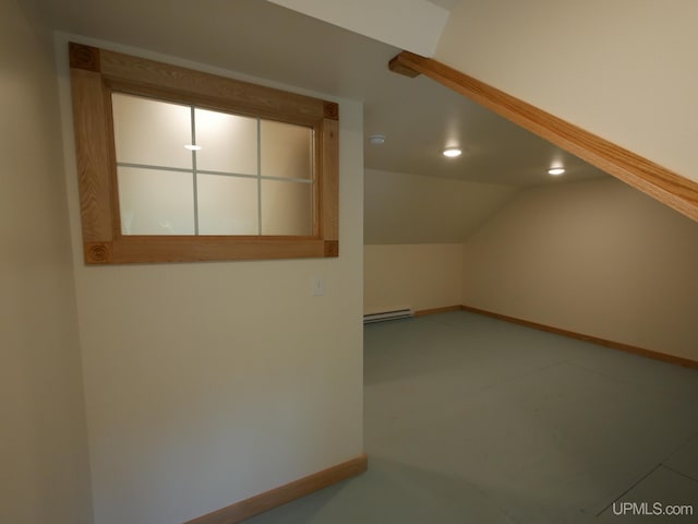 additional living space with baseboard heating, baseboards, vaulted ceiling, and recessed lighting
