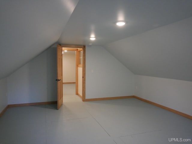 additional living space with lofted ceiling