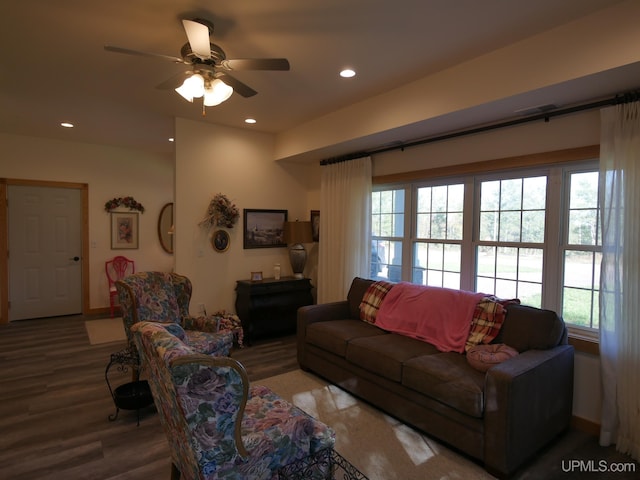 living room with wood-type flooring and ceiling fan