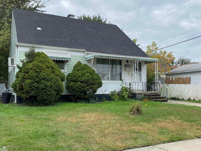 bungalow-style home featuring a front yard