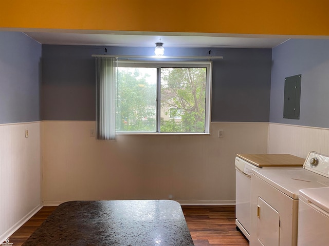 kitchen with white cabinets, hardwood / wood-style floors, electric panel, and separate washer and dryer