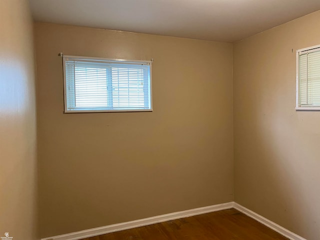 unfurnished room featuring wood-type flooring