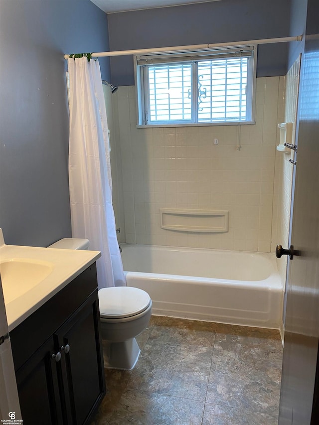 full bathroom with vanity, toilet, and shower / bath combo with shower curtain