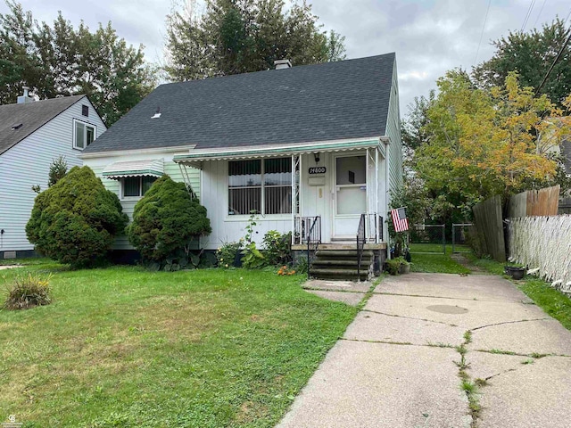 bungalow-style house with a front lawn