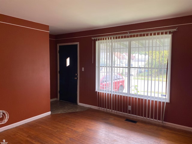 entryway with hardwood / wood-style floors