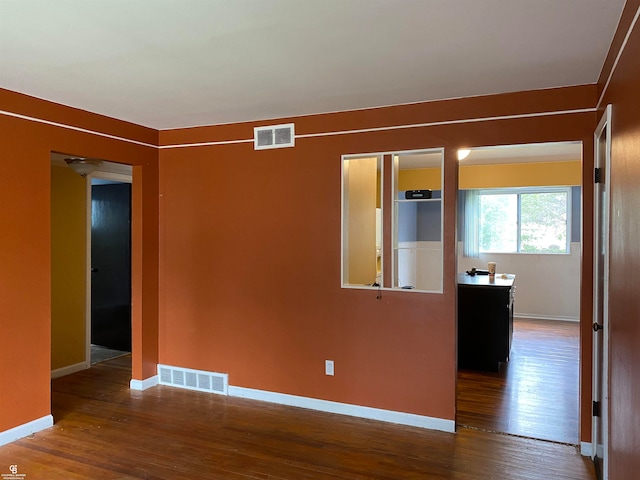 spare room featuring hardwood / wood-style floors