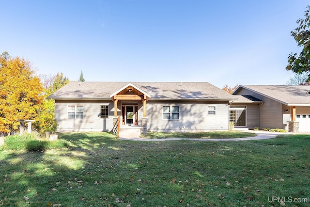 23 Chipman Dr, Ishpeming, MI 49849 - ranch-style house with a front yard