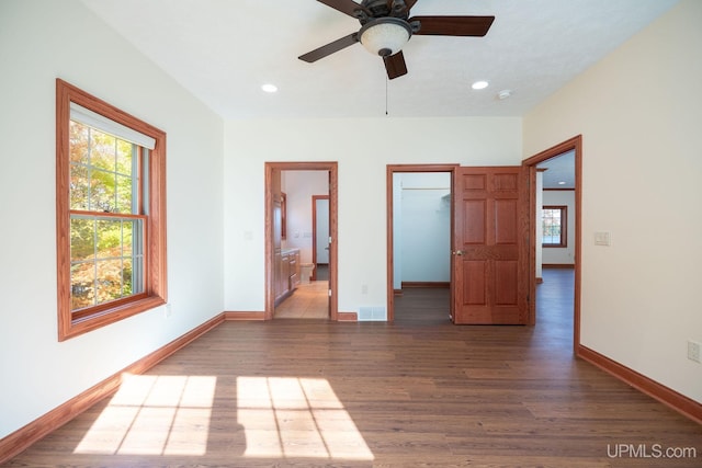 23 Chipman Dr, Ishpeming, MI 49849 - unfurnished bedroom featuring wood finished floors, multiple windows, baseboards, and recessed lighting