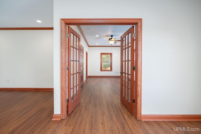 23 Chipman Dr, Ishpeming, MI 49849 - corridor featuring french doors, crown molding, baseboards, wood finished floors, and recessed lighting