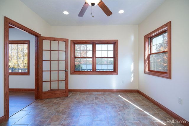 23 Chipman Dr, Ishpeming, MI 49849 - spare room featuring plenty of natural light, baseboards, ceiling fan, and recessed lighting