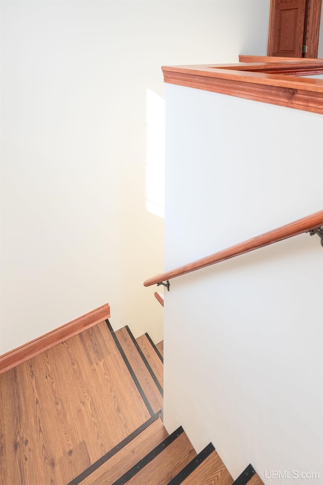 23 Chipman Dr, Ishpeming, MI 49849 - stairway with wood finished floors