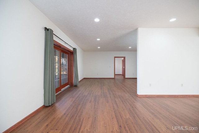 23 Chipman Dr, Ishpeming, MI 49849 - empty room with recessed lighting, baseboards, and wood finished floors