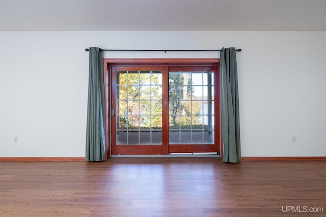 23 Chipman Dr, Ishpeming, MI 49849 - empty room with wood finished floors and baseboards