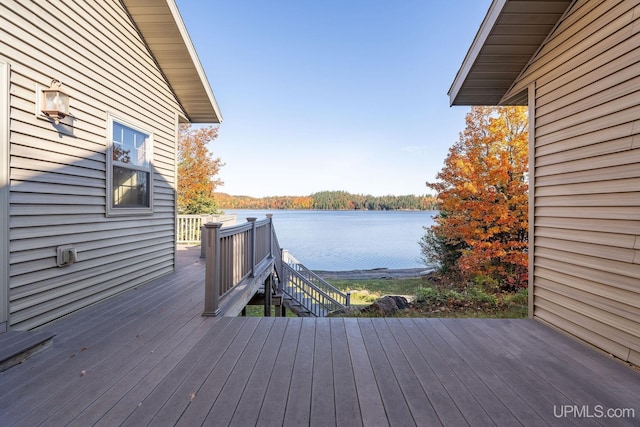 23 Chipman Dr, Ishpeming, MI 49849 - wooden deck featuring a water view and stairway