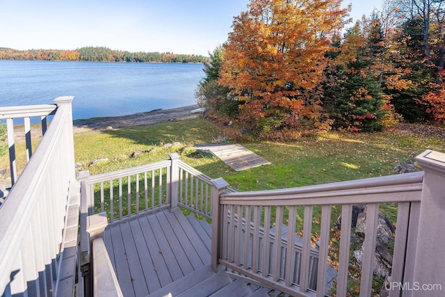 23 Chipman Dr, Ishpeming, MI 49849 - wooden terrace with a water view and a lawn