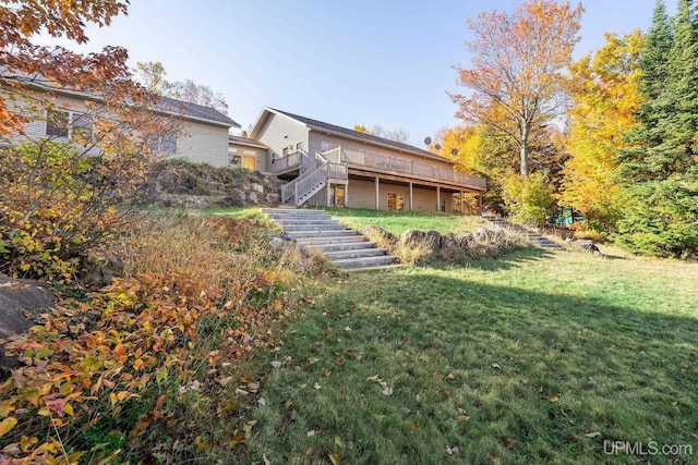 23 Chipman Dr, Ishpeming, MI 49849 - rear view of house featuring stairs, a deck, and a yard