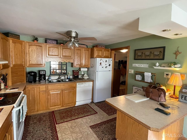 kitchen with ceiling fan, sink, white appliances, a kitchen island, and exhaust hood