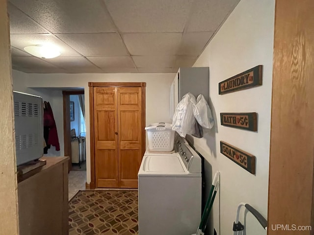 clothes washing area with separate washer and dryer and dark carpet